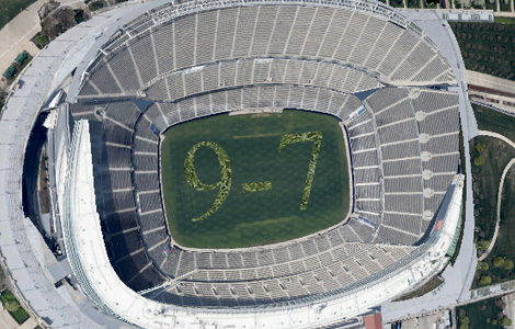 Satellite image reveals hidden message in stadium turf. Is it a message to their alien masters? We may never know...